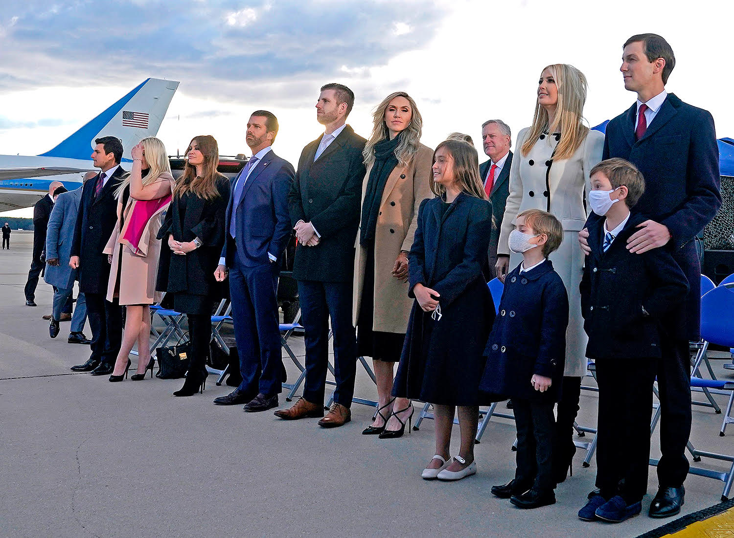 Ivanka Trump (2nd R), husband Jared Kushner (R), their children, Eric (C-R) and Donald Jr. (C-R) and Trump family members stand on the tarmac at Joint Base Andrews in Maryland as they arrive for US President Donald Trump's departure on January 20, 2021. - President Trump travels to his Mar-a-Lago golf club residence in Palm Beach, Florida, and will not attend the inauguration for President-elect Joe Biden. (Photo by ALEX EDELMAN / AFP) (Photo by ALEX EDELMAN/AFP via Getty Images)