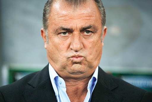 Turkey's coach Fatih Terim reacts before their 2014 World Cup qualifying soccer match against Romania at National Arena in Bucharest September 10, 2013. REUTERS/Bogdan Cristel (ROMANIA - Tags: SPORT SOCCER)